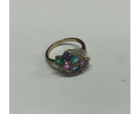 A 9 carat multi gem set ring. Approx. 4 grams. Est. £30 - £40.