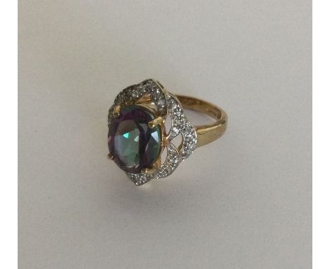 A heavy 9 carat diamond set ring with transitional central stone. Approx. 5 grams. Est. £40 - £60.