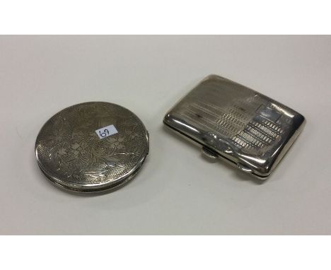 An engine turned silver cigarette box together with a compact. Approx. 104 grams. Est. £30 - £40.