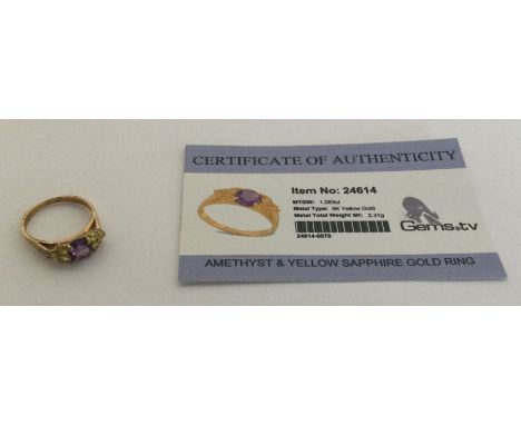 An amethyst and yellow sapphire ring set in 9 carat. Approx. 2.31 grams. Est. £25 - £35.