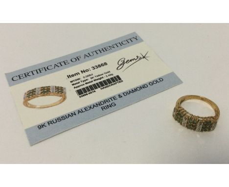 An alexandrite and diamond ring set in 9 carat. Approx. 3.49 grams. Est. £25 - £35.