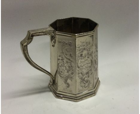 A fine quality octagonal shaped silver christening cup with floral decoration. London. By KR. Approx. 151 grams. Est. £100 - 