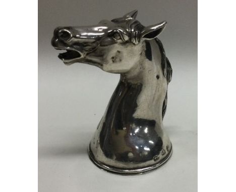 A rare silver stirrup cup in the form of a horse. Marked to body. Circa 19th Century. Approx. 91 grams. Est. £350 - £450.