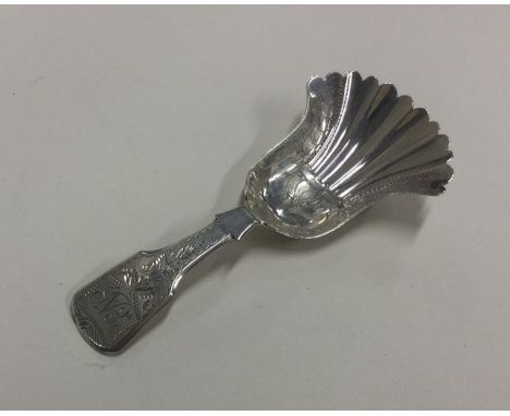 A bright cut silver caddy spoon. Birmingham 1830. By Taylor &amp; Perry. Approx. 9 grams. Est. £60 - £80.