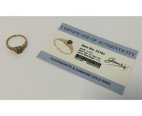 An alexandrite and diamond ring set in 9 carat. Approx. 1.71 grams. Est. £25 - £35.
