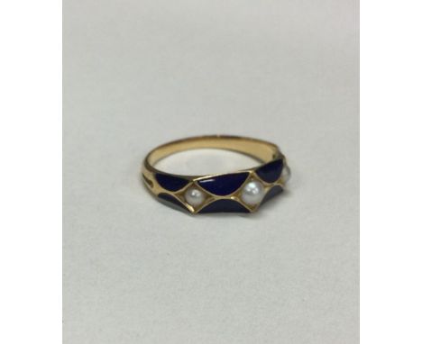 A gold and enamelled memorial ring with pearl decoration. Approx. 2 grams. Est. £40 - £60.