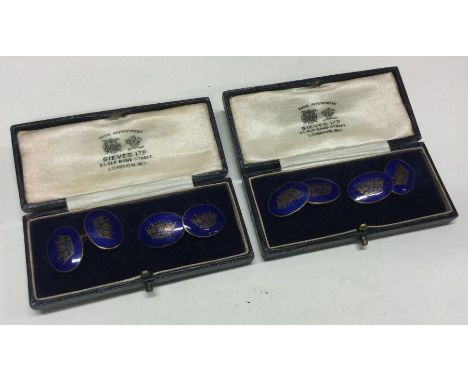 Two boxed pairs of matching cufflinks with crown enamel decoration. Est. £30 - £40.