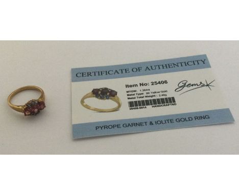 A pyrope garnet and iolite ring set in 9 carat. Approx. 2.46 grams. Est. £25 - £35.