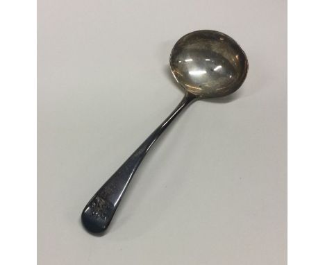 An OE pattern silver cream ladle with crested terminal. Approx. 23 grams. Est. £20 - £30.