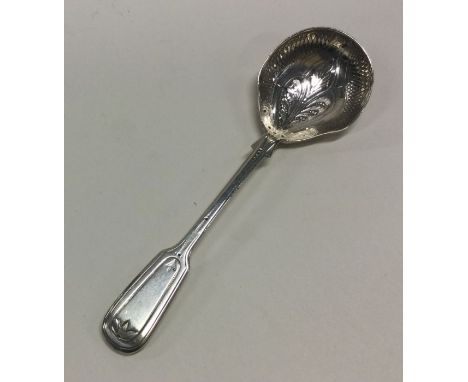 EXETER: A large bright cut silver caddy spoon. By JW&amp;Co. Approx. 28 grams. Est. £30 - £40.