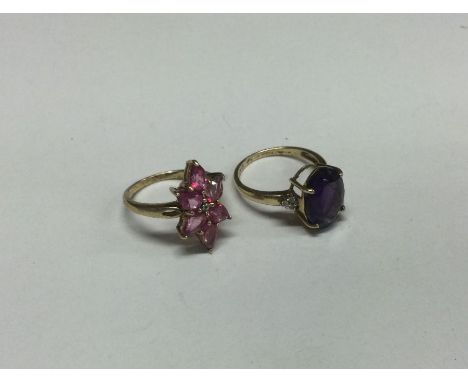 A9 carat amethyst and diamond mounted ring together with one other. Approx. 6 grams. Est. £40 - £60.