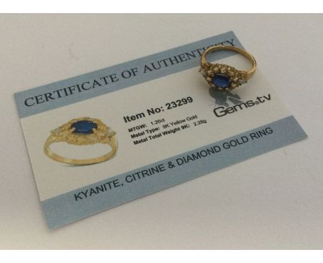 A kyanite, citrine and diamond ring set in 9 carat. Approx. 2.28 grams. Est. £25 - £35.