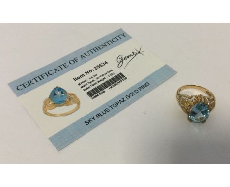 A blue topaz ring set in 9 carat. Approx. 3.52 grams. Est. £25 - £35.