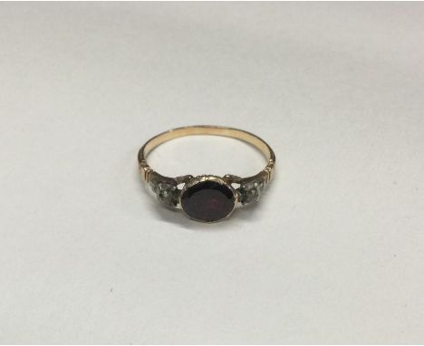 A good early Georgian garnet mounted ring with concealed back to reeded shank. Approx. 2 grams. Est. £100 - £150.