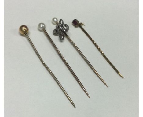 A good group of Antique gold stick pins mounted with diamonds and pearls. Approx. 4 grams. Est. £50 - £80.