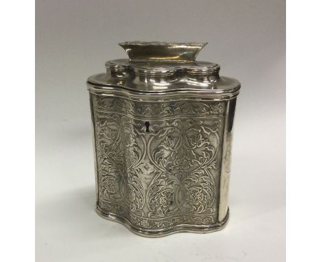 KRUGER: A good South African silver hinged top tea caddy with scroll decoration and crested side to hinged lid. Marked to bas