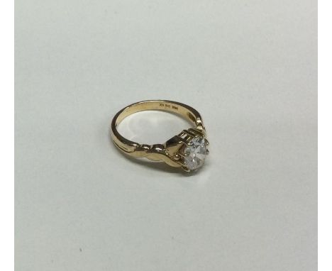 A 9 carat single stone ring in claw mount. Approx. 3 grams. Est. £20 - £30.