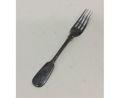 A small Georgian fiddle pattern silver dessert fork. London. By GA. Approx. 24 grams. Est. £20 - £30.