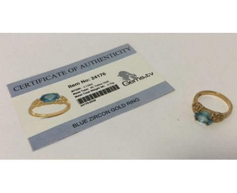 A blue zircon ring set in 9 carat. Approx. 2.7 grams. Est. £25 - £35.