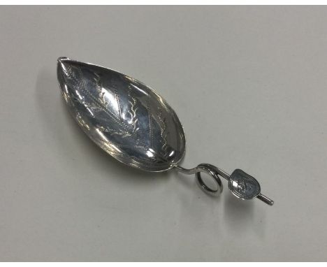 A pear shaped bright cut silver caddy spoon. Birmingham circa 1830. By Joseph Wilmore. Approx. 6 grams. Est. £60 - £80.