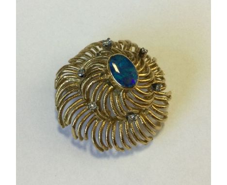 A heavy 18 carat modernistic opal and diamond mounted brooch. Approx. 14 grams. Est. £150 - £200.