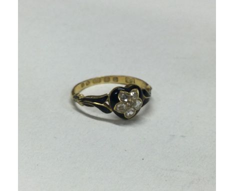 A good Antique enamel memorial ring attractively decorated with diamonds set in 18 carat gold. Approx. 2 grams. Est. £80 - £1