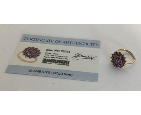 An amethyst cluster ring set in 9 carat. Approx. 3.04 grams. Est. £25 - £35.