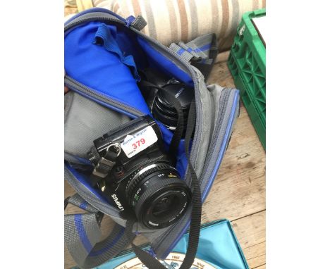 An Olympus OM40 camera and lenses. 