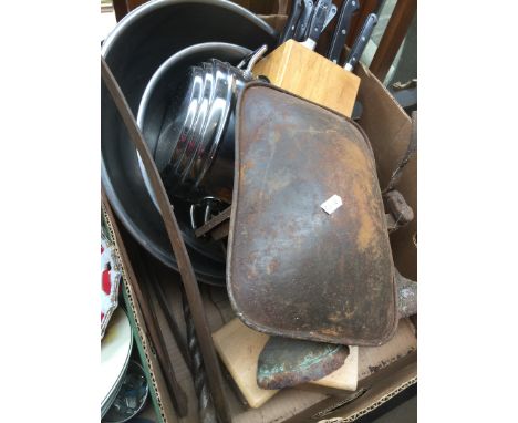 A box of metalware and kitchen items including vintage scales. 
