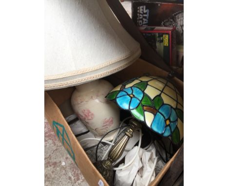 A box containing a Tiffany style table lamp and another. 