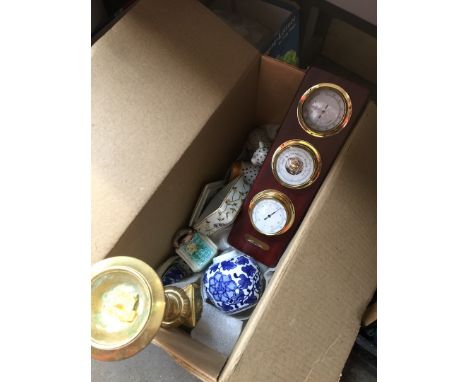 A box containing a brass candle holder, trinket boxes, vases, etc 