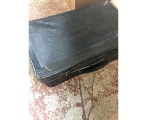A vintage case and a house phone. 