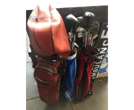 Three bags of vintage golf clubs. 