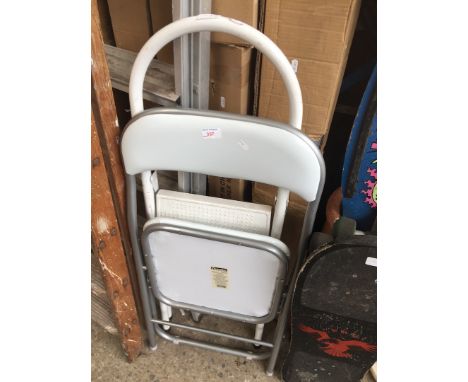 A chair and a metal step ladder 