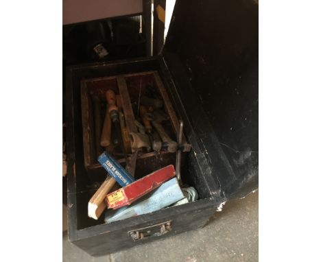 A wooden chest with tools 