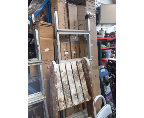 An aluminium step ladder and a wooden step ladder 