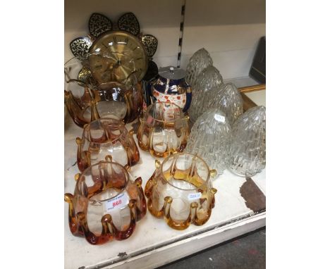 Glass lamp shades, some pottery and a clock 