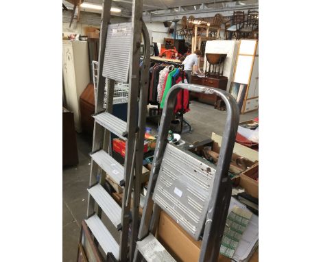 Pair of aluminum step ladders 