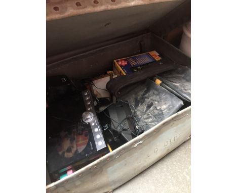 A large old trunk containing misc items, including games, Dewalt workers pouch, Goodmans cd micro system with dock for Iphone