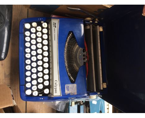 A vintage portable typewriter. 