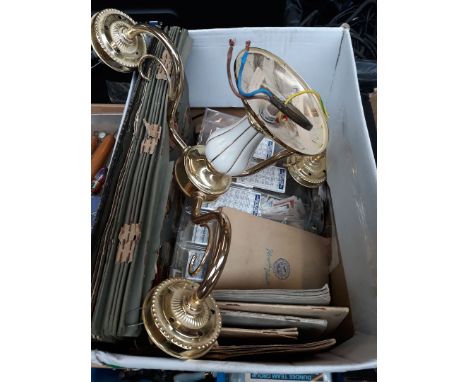 A box containing cigarette cards, a light fitting and a scrap book. 