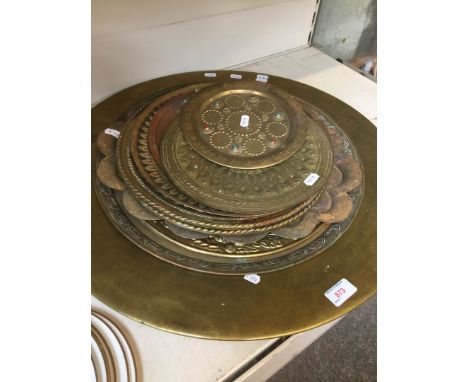 Various brass chargers and plates 