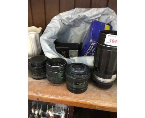 A bag of camera lenses and equipment. 