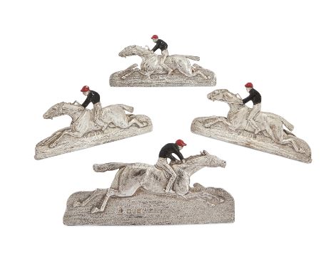 Horse racing interest. Four novelty silver and enamel menu holders designed as galloping racehorses, the jockeys in enamelled