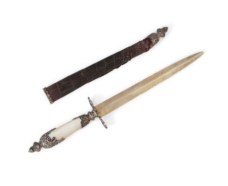 A late 19th/early 20th century silver gilt paper knife in the form of a dagger, marks rubbed, with mother of pearl handle wit