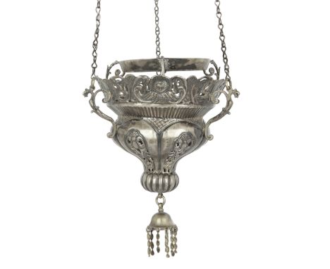 A Turkish silver hanging lamp, Ottoman Empire, 19th century, of ogee mosque lantern form, pierced and embossed with masks, fl