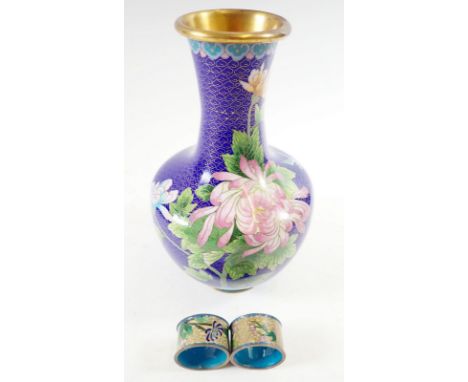 A floral cloisonne enamel vase 26cm and two cloisonne napkin rings 