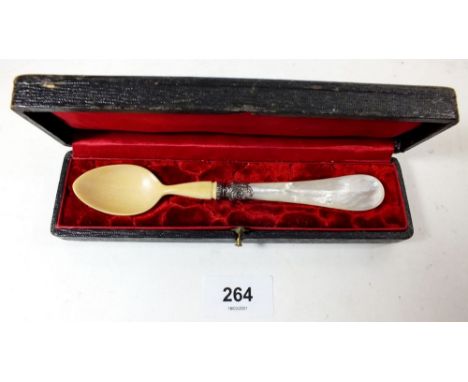 An ivory and mother of pearl caviar spoon with white metal mounts