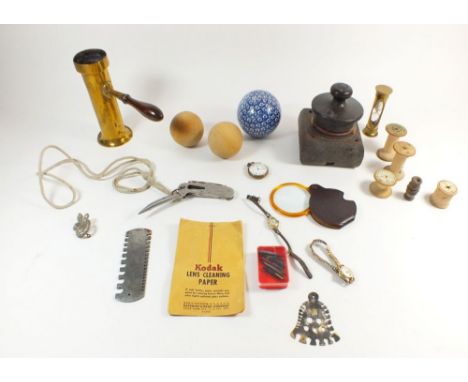 A box of collectables including: wooden cotton reels, egg timer, pen nibs etc. 