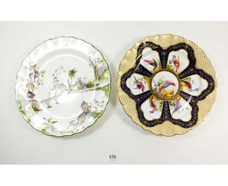 A Royal Worcester plate painted exotic bird reserves on blue and gilt ground, 1897, 22.5cm and another Worcester plate decora